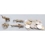 Four cast brass miniature figures including a particularly well cast lizard and a quantity of coins