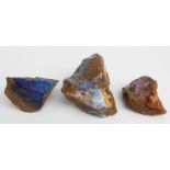 Three large uncut opal boulders.