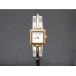 Gucci gold plated ladies wristwatch ref. 1900L with gold hands, white dial and quartz movement, on