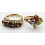 A 9ct gold ring set with garnets and diamonds and a 9ct gold ring set with blue topaz, garnet,