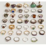 A collection of silver and costume rings