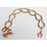 A 9ct gold bracelet made up of horseshoe links with 9ct gold horse charm, 19.1g