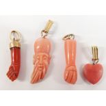 Two Victorian coral charms in the form of hands, largest 2cm long, a carved Chinese coral pendant,