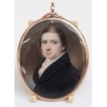 Victorian gold double sided locket set with a painted ivory miniature of a young gentleman, verso