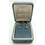 A pair of 18ct gold earrings set with a diamond to each measuring approx 0.15ct