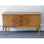 Gordon Russell of Broadway sideboard with three drawers flanked by two cupboards, W142 x D49 x