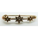 Edwardian gold brooch set with seed pearls in star settings, 1.6g, 3.3cm