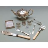 Three hallmarked silver napkin rings and a collection of silver plated ware including teapot,