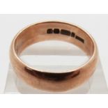 A 9ct rose gold wedding band dated 1936, 9.4g, size W