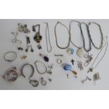 A collection of silver jewellery including rings set with agate, silver earrings, silver necklace