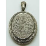 Victorian silver locket with engraved floral decoration verso ivy decoration