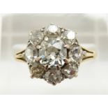 Victorian 18ct gold ring set with old cut diamonds in a cluster, the centre diamond approximately