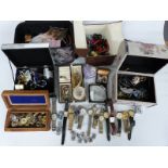 A large collection of costume jewellery including rings, brooches, watches, silver locket, beads,