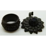 A volcanite pendant and a Victorian  carved jet ring