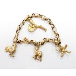 A yellow metal bracelet with gold plated charms