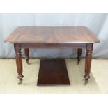 Victorian mahogany extending dining table with extra leaf, reeded legs and brass castors, max