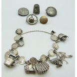 A silver Maundy bracelet set with silver charms, Victorian silver buttons, silver thimble etc