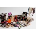 A collection of costume jewellery including glass pendants, beads, etc