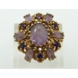 A 9ct gold ring set with amethysts, 7g, Size N