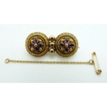 Victorian Etruscan Revival gold brooch set with foiled amethysts within applied rope twist