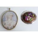 A silver brooch set with a painted plaque depicting a pansy and a miniature painting on ivory in a