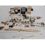 A collection of costume jewellery, brooches, cameos, beads etc