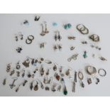 A large collection of silver earrings including Mackintosh style examples, gem set examples etc