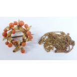 A yellow metal pendant/brooch set with coral beads in a textured foliate wreath, 7.4g (3 x 3.2cm)