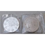 Two Mexican one ounce silver coins