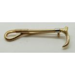 A 9ct gold riding crop brooch, 3.7cm long