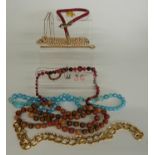 A collection of costume jewellery including silver necklace, beads, snake necklace, etc