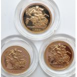 A cased trio of gold half sovereigns, two for 1982 the third a 1984 example