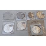 Five USA silver one dollar coins together with a one dollar and half dollar cupro nickel examples