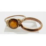 A 9ct gold ring set with a citrine and a yellow metal wedding band marked 333, 4.9g