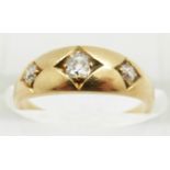 Victorian 18ct gold ring set with three diamonds in square setting, the centre diamond approximately