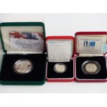 Three silver proof piedfort coins comprising crown, one pound and fifty pence, cased with