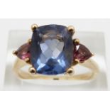 A 9ct gold three stone ring, the central blue paste stone flanked by two pink stones, 5.4g, size S