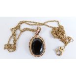 A 9ct gold pendant set with smoky quartz and a chain, 4.3g