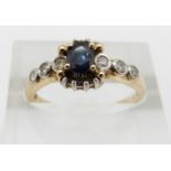 A 9ct gold ring set with a sapphire and diamonds, 2.3g, size O