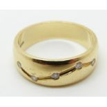 An 18ct gold ring set with diamonds, 7g, size M