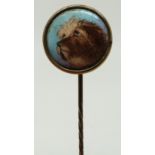 A stick pin with enamel dog finial