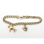 A 9ct gold curb link bracelet with a 9ct gold dog charm and heart padlock clasp, 19.4g