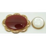 A 9ct gold brooch set with an agate plaque and a 9ct gold brooch set with a reverse glass cameo with