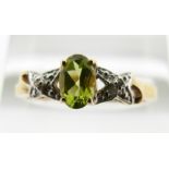 A 9ct gold ring set with peridot and diamonds, 1.6g, size P
