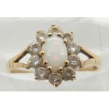 A 9ct gold opal ring with diamond surround, 1.5g, size K
