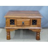 An Eastern hardwood coffee table with two drawers and decorative ironwork, W60 x H41cm