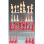 19thC Chinese export ivory 'Burmese' pattern part chess set, stained red and natural, the kings