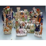 Eleven 19thC Staffordshire figural spill vases including Burns and Mary Welsh, Shepherds etc,