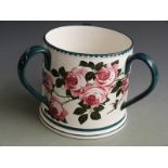 Large Bristol/ Pountney three handled tyg hand painted with cabbage roses on a white background