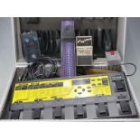 Boss ME-8B bass multiple effects guitar unit with power supply, together with a bass equalizer,